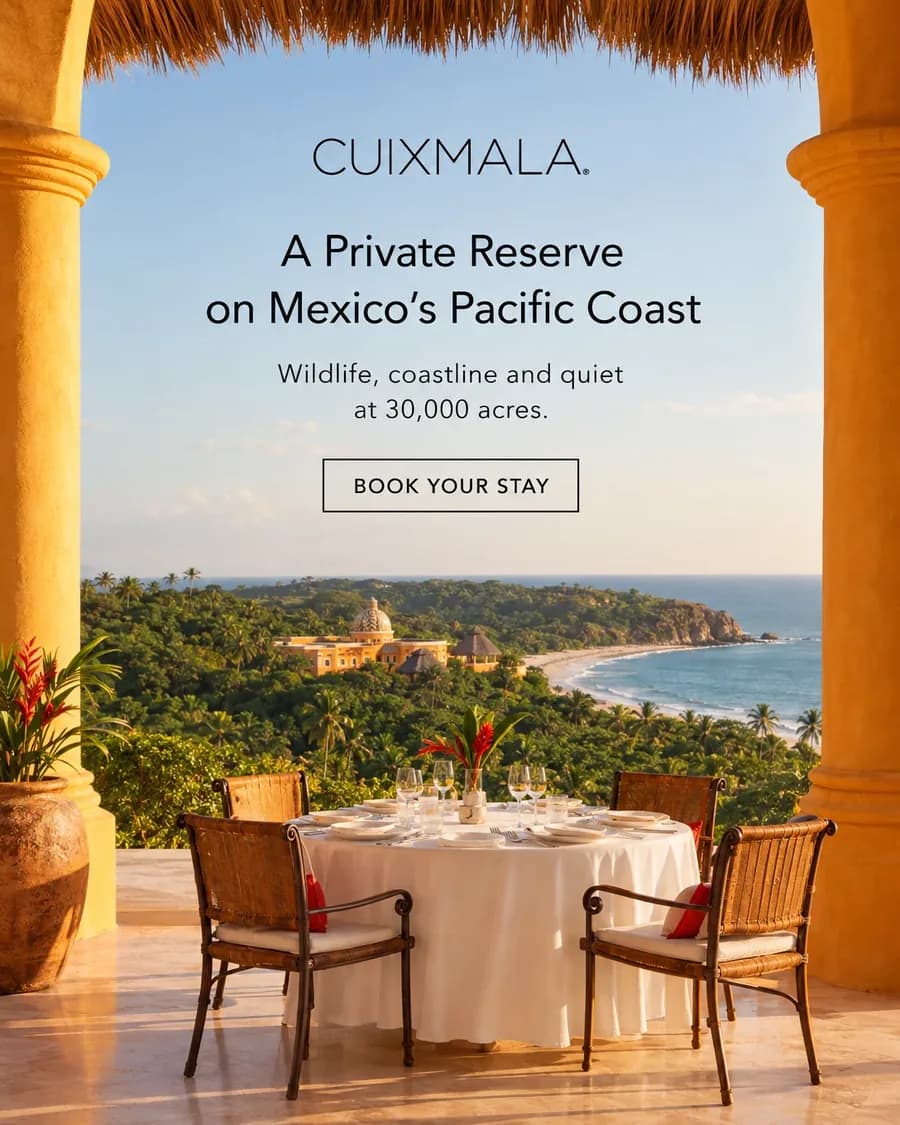 Cuixmala Meta ad: a terrace table above the jungle and the coastline, headline A Private Reserve on Mexico's Pacific Coast and a Book your stay button